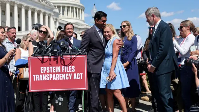 U.S. Representative Ro Khanna (D-CA) interacts with Representative Marjorie Taylor Greene