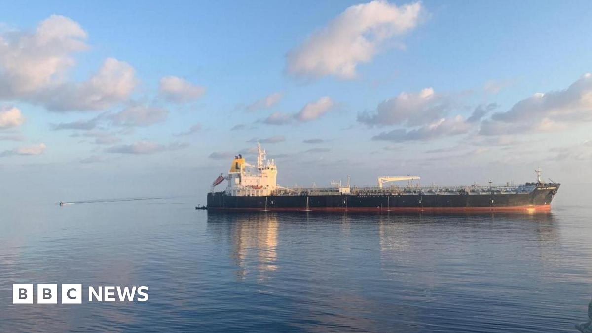 An oil tanker in a body of water