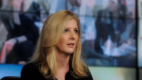 NBCUniversal via Getty Images Kathy Ruemmler, with long blond hair and wearing a black top, on the set of the NBC's "Meet the Press"