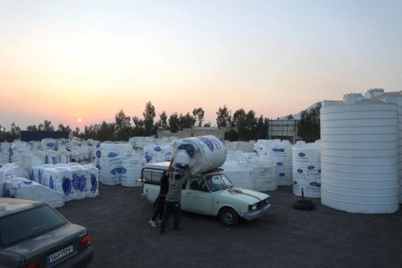 People shop water storage tanks following a drought crisis in Tehran, Iran, November 10, 2025. 