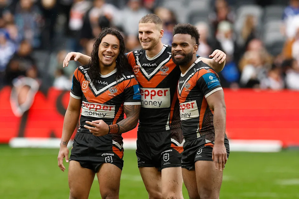 Jarome Luai, Adam Doueihi and Sunia Turuva celebrate victory.