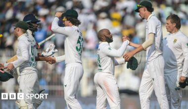 India and South Africa players shake hands after the first Test