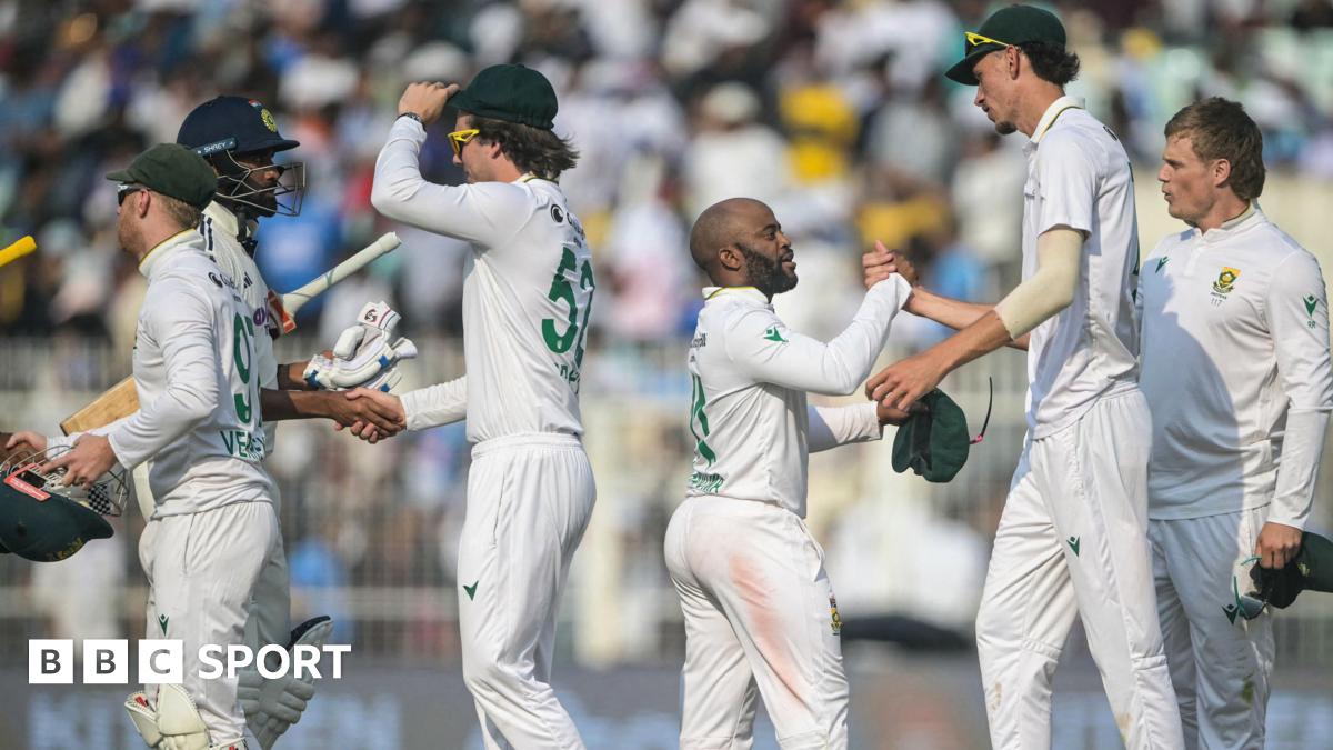 India and South Africa players shake hands after the first Test