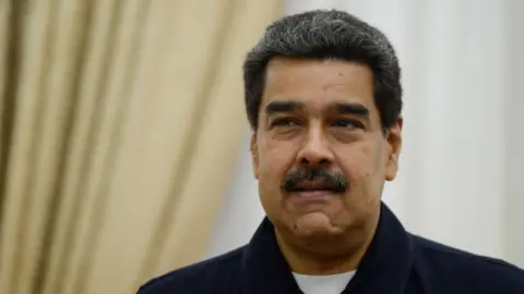 Getty Images Nicolás Maduro, President of Venezuela, gestures ahead of a meeting at the Miraflores Palace in Caracas on 9 July 2019.