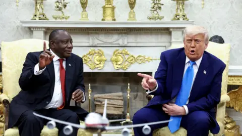 Reuters  Cyril Ramaphosa sits in the Oval Office next to Donald Trump in May 2025. 