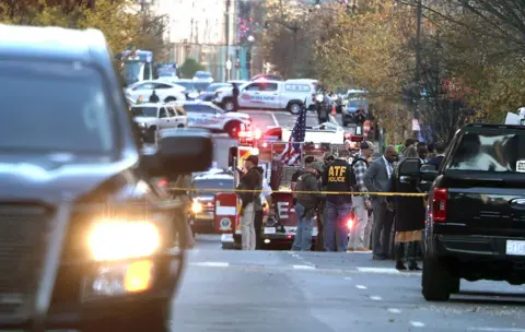 Getty Images US law enforcement officers gathered near the scene of a shooting in Washington DC. 