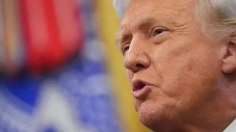 PA President Donald Trump speaks to reporters in the Oval Office of the White House on Monday