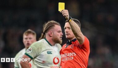Matthew Carley shows yellow card