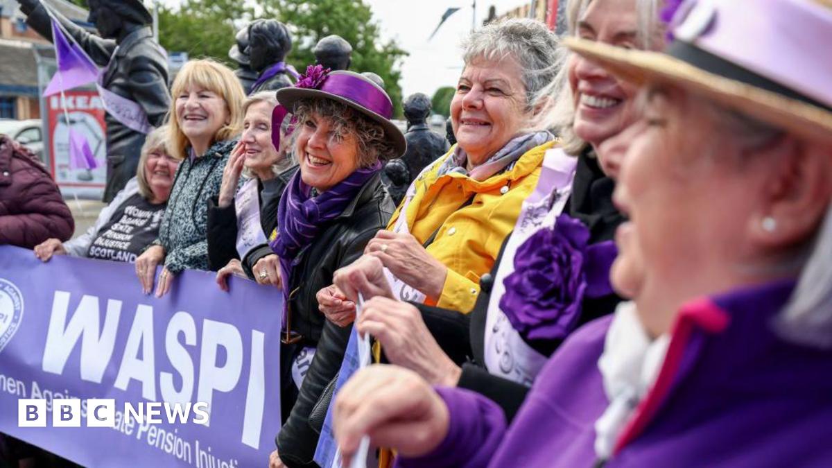 A line of Waspi campaigners holding a banner with the name of the campaign on it.
