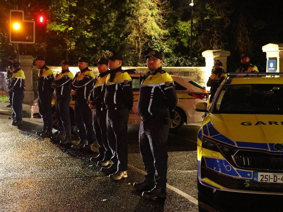 Gardaí form a cordon across the entrance to Citywest Hotel, Saggart as protesters gathered. Photo: Collins