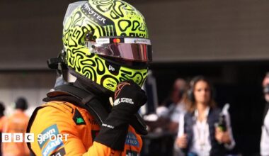 McLaren's Lando Norris clenches his right fist in celebration after taking pole position for the Sao Paulo Grand Prix sprint race