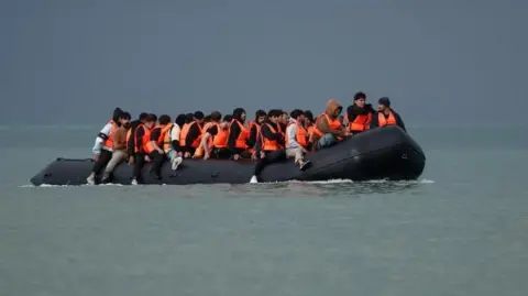 Reuters An inflatable dinghy carrying migrants crosses the English Channel