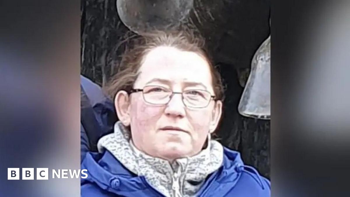 A head and shoulders picture of Marta Bednarcyzk, who has a blue coat and a fleece on. She has glasses and brown or ginger hair tied back, looking towards the camera.