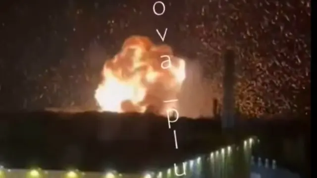 A large ball of flame erupts from the port of Novorossiysk