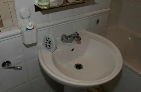Met Police An air freshener in the bathroom in Xu’s flat has a hidden camera