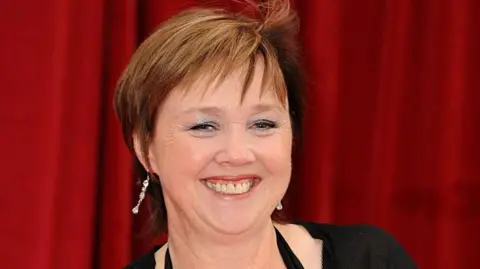 Getty Images Pauline Quirke smiling in a smart outfit