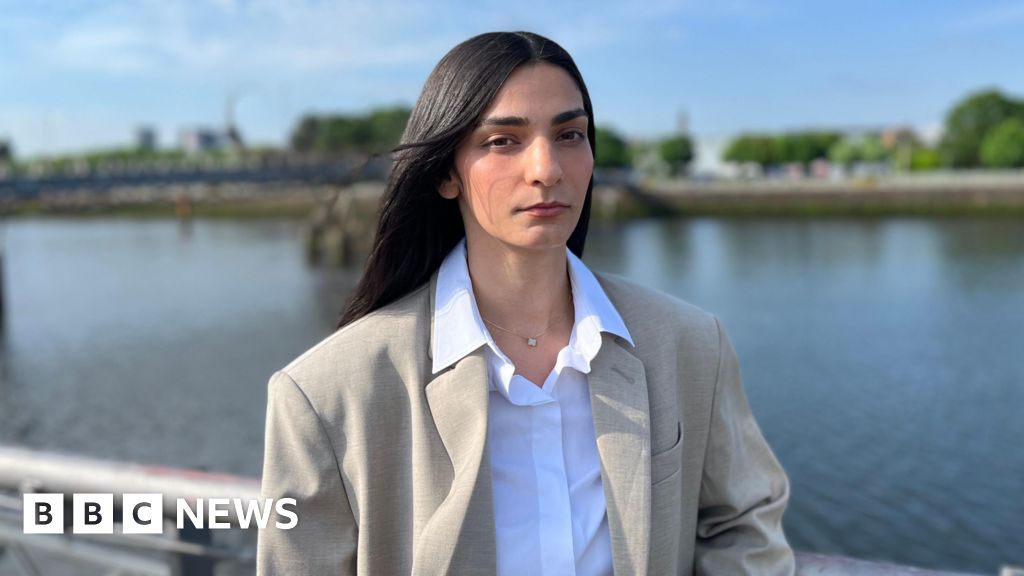 GP who 'harassed' woman raped by his son appears in court