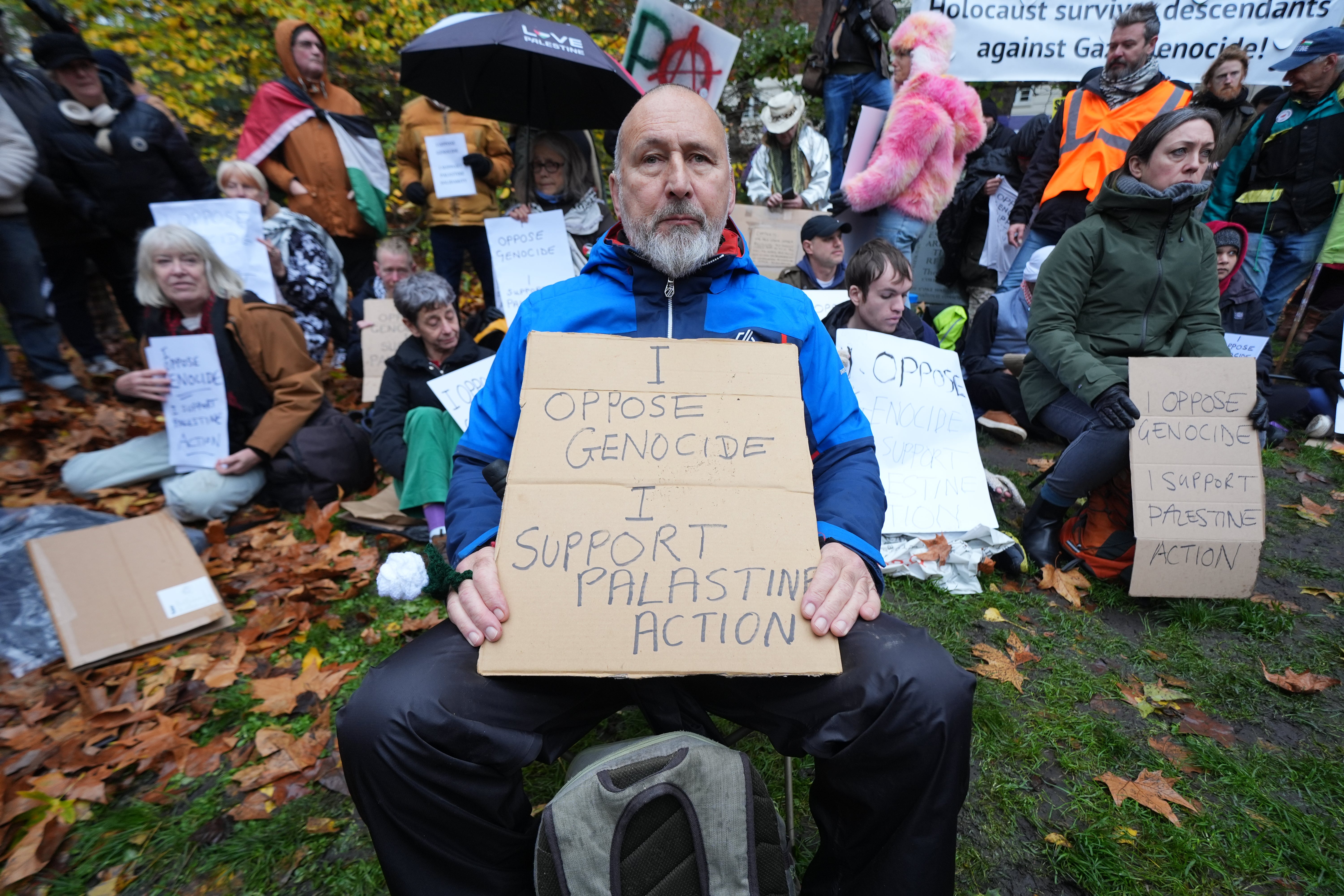 Man holding a sign at the London protest