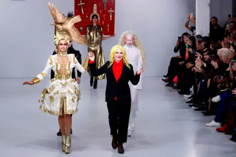 Getty Images Model s and fashion designer Pam Hogg walks the runway at the Pam Hogg show during London Fashion Week February 2020 at the Fashion Scout Venue on February 16, 2020 in London, England.