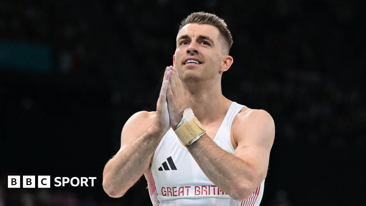 Max Whitlock puts his hands together after a routine
