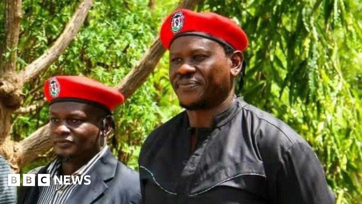 Bob Njagi and Nicholas Oyoo dressed in black clothing and wearing red berets associated with Uganda’s opposition National Unity Platform (NUP), the party of Bobi Wine
