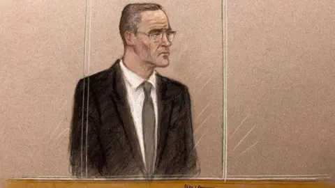 Julia Quenzler/BBC A sketch of Paul Doyle, 54, standing in a dock behind a plastic screen wearing a black suit over a white shirt and tie