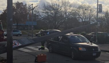 Woman hurt after pole falls on vehicle in Toronto's west end