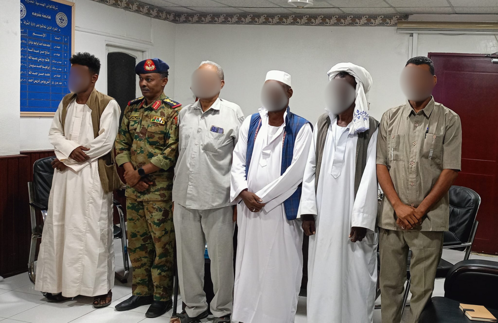 This photograph published on Facebook November 8, 2023, shows Sudanese Army Colonel Anas Younis (second from left, in uniform) at a meeting.