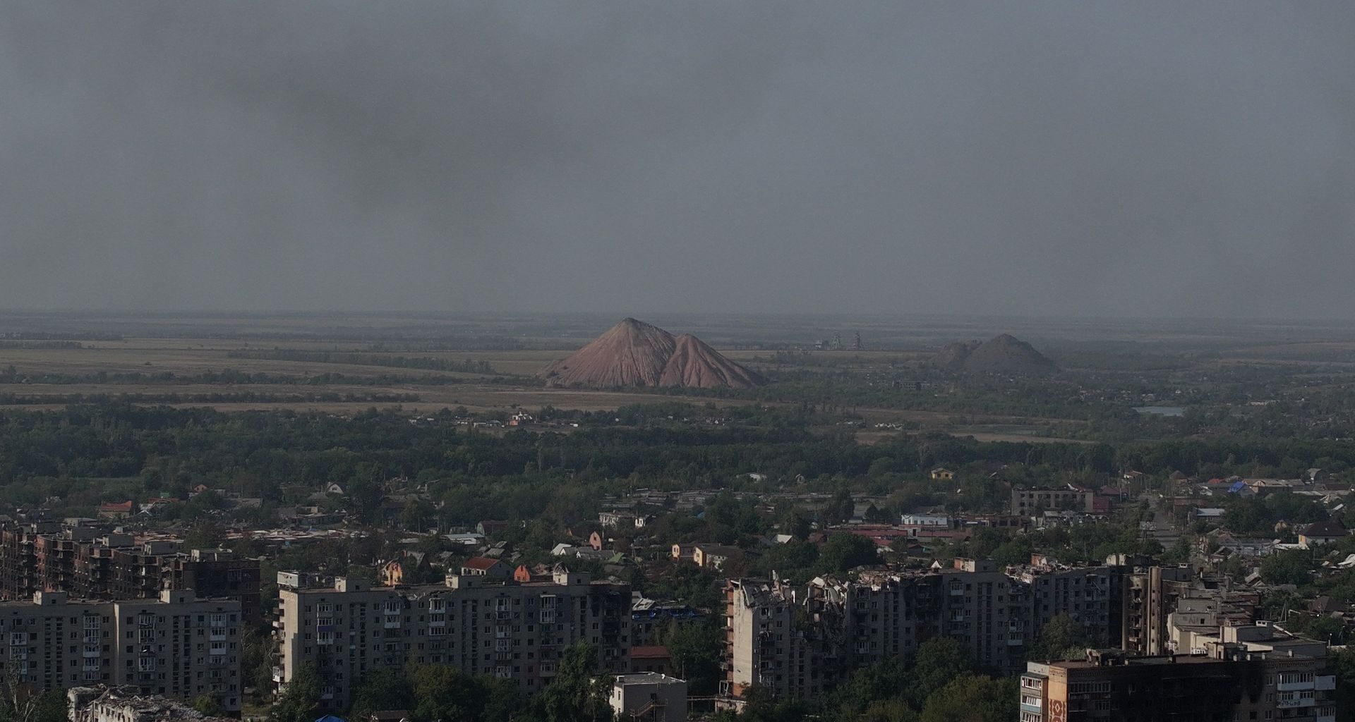 A Mazda Motor Corp. sign, alongside a Sollers PJSC sign in Vladivostok, Russia, on Sept. 3, 2019. (Andrey Rudakov/Bloomberg via Getty Images)