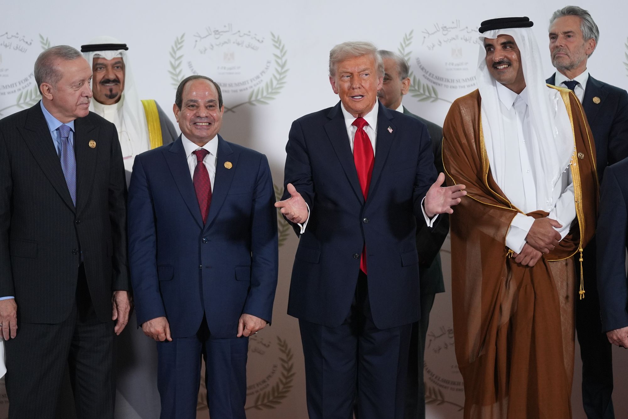 Trump gestures as Turkey's president Recep Tayyip Erdogan, Egypt's president Abdel-Fattah el-Sissi and Qatar prime minister and foreign minister Sheikh Mohammed bin Abdulrahman bin Jassim Al Thani look on during a world leaders' summit on ending the Gaza war on 13 October 2025 in Sharm El-Sheikh, Egypt