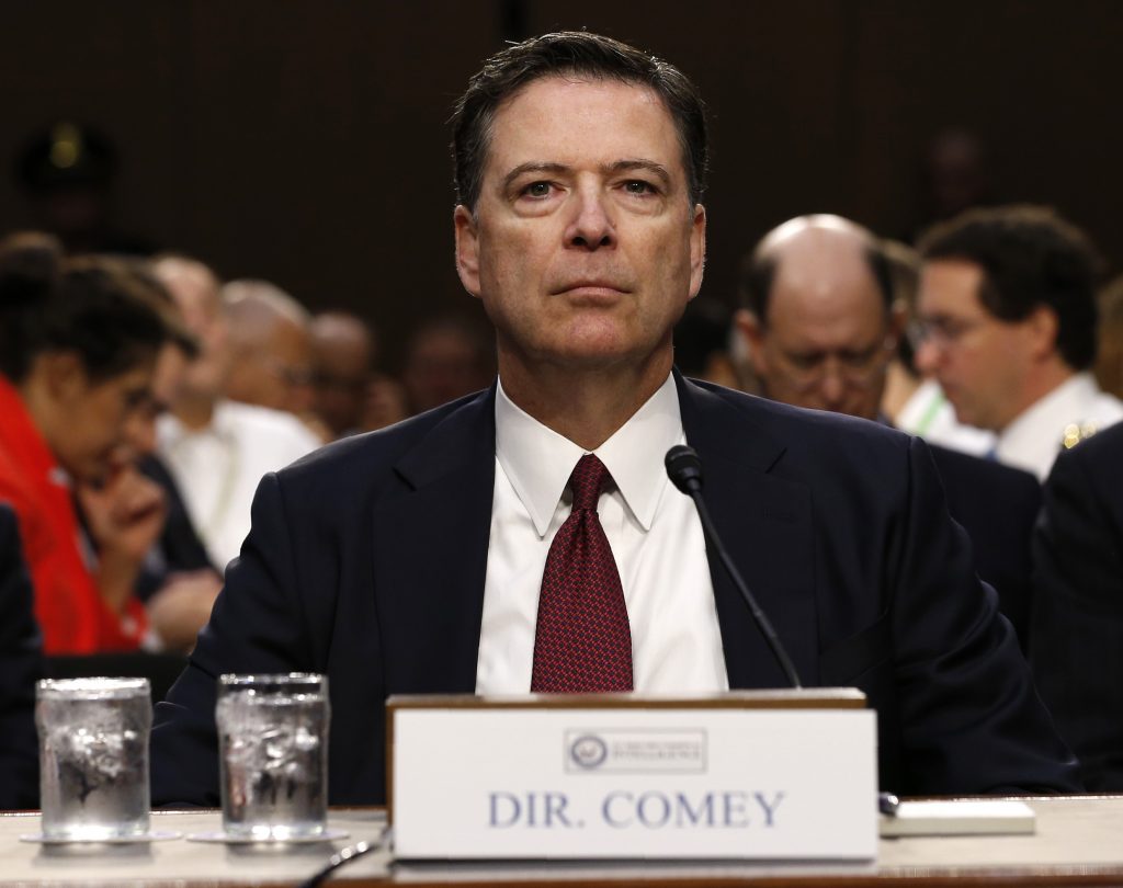 Former FBI Director James Comey testifies at a Senate Intelligence Committee hearing on Russia's alleged interference in t...