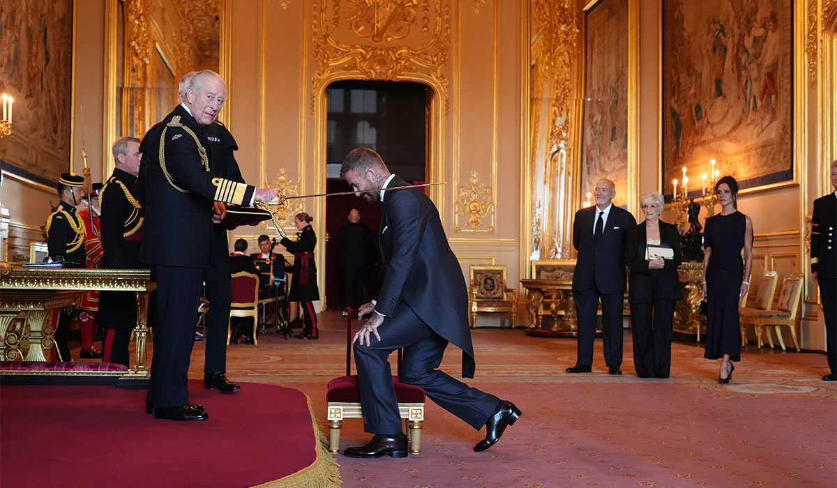 Sir David Beckham is made a Knight Bachelor by King Charles III during an Investiture ceremony at Windsor Castle, Berkshire. Pic: Jonathan Brady/PA Wire