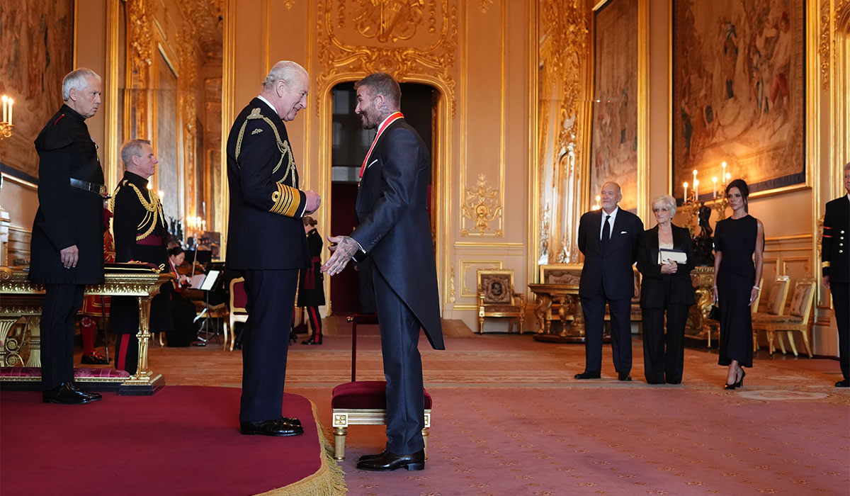 Sir David Beckham is made a Knight Bachelor by King Charles III during an Investiture ceremony at Windsor Castle, Berkshire. Pic: Jonathan Brady/PA Wire