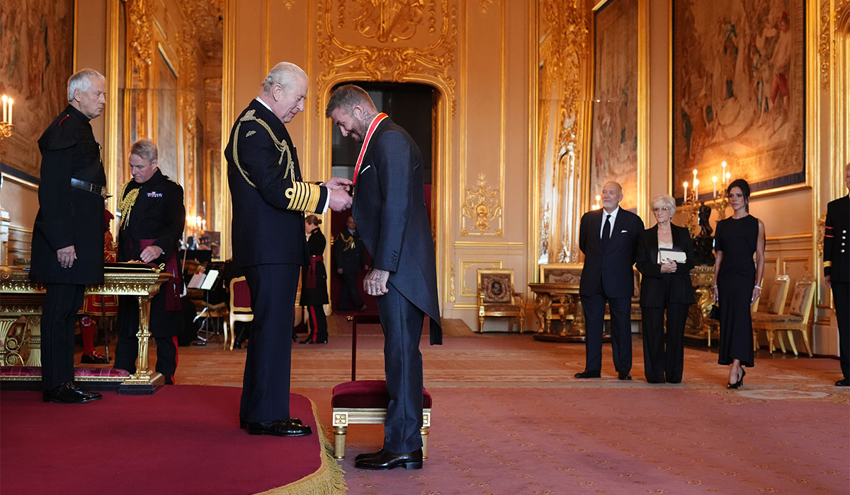 Sir David Beckham is made a Knight Bachelor by King Charles III during an Investiture ceremony at Windsor Castle, Berkshire. Pic: Jonathan Brady/PA Wire