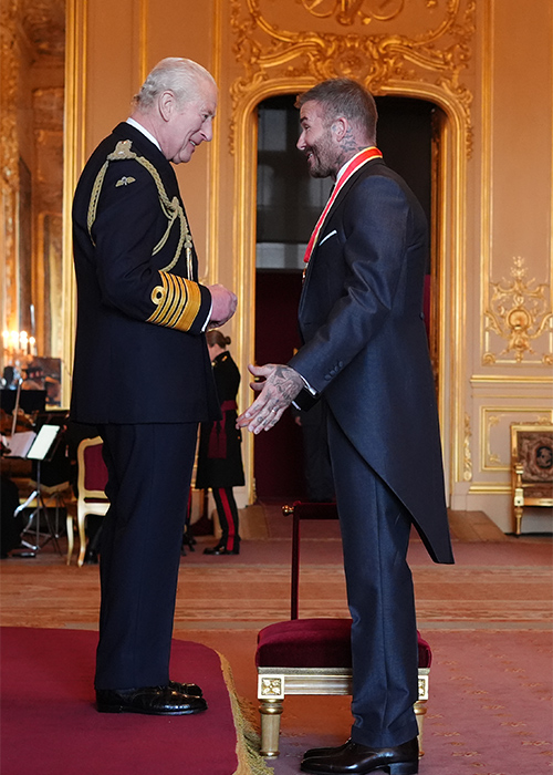 Sir David Beckham is made a Knight Bachelor by King Charles III during an Investiture ceremony at Windsor Castle, Berkshire. Pic: Jonathan Brady/PA Wire