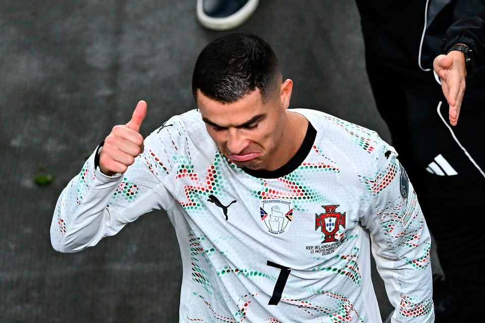 Cristiano Ronaldo of Portugal reacts after being shown a red card