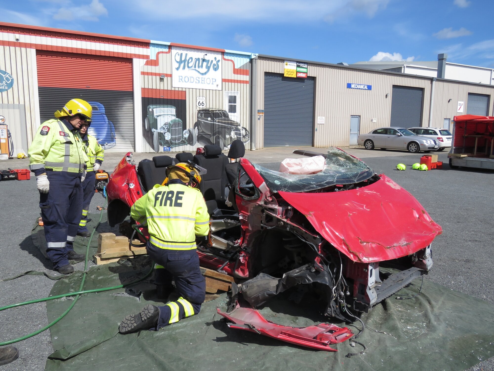 Three firefighters learning how to use rescue tender equipment on the recent MVE course in Katikati. Photo / Merle Cave
006: need name ….. Photo / Merle Cave