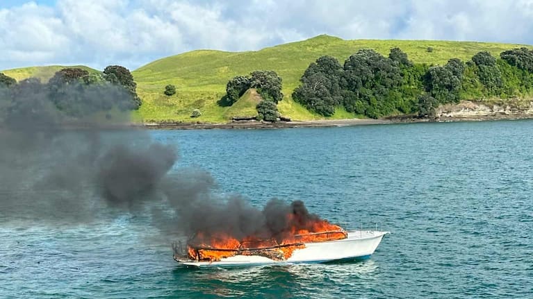 A launch engulfed in flames on Auckland's Hauraki Gulf. (Source: Supplied / SeaLink)