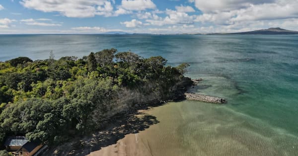 Woman rescued from battering of incoming tide at Castor Bay