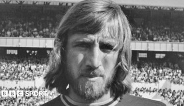 A black and white head and shoulders photograph of Billy Bonds in his West Ham kit