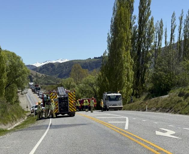 Emergency services at the scene of the crash in Gibbston Valley today. Photo: Still Vision...