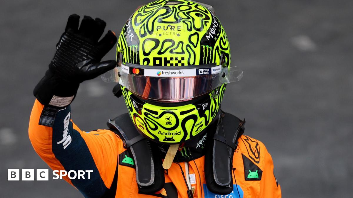 McLaren's Lando Norris waves in celebration after taking pole position for the Sao Paulo Grand Prix