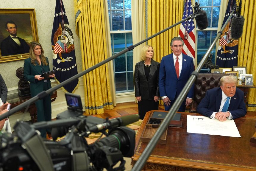 Lindsey Halligan attends an event in the Oval Office, alongisde President Donald Trump, Interior Secretary Doug Burgum and Burgum's wife Kathryn on January 31.