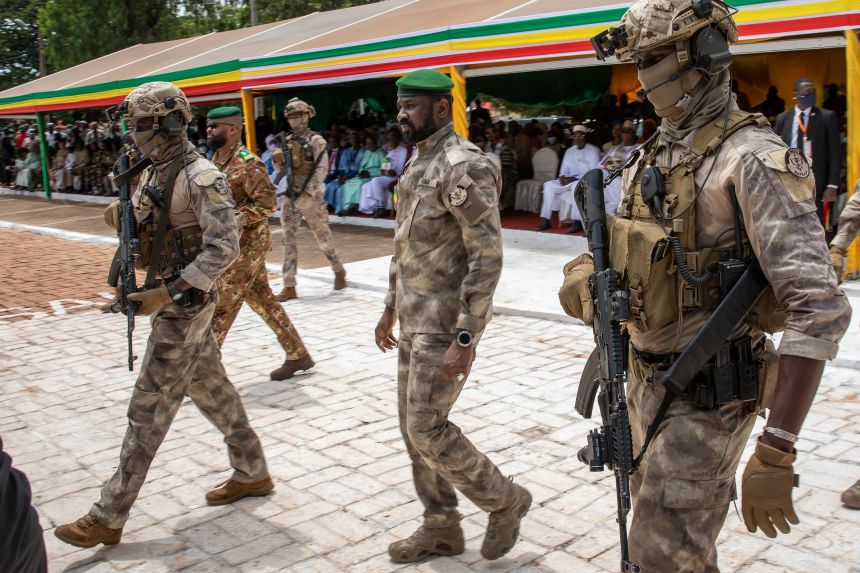 Assimi Goïta, center, attends an independence day military parade in Bamako on September 22, 2022.