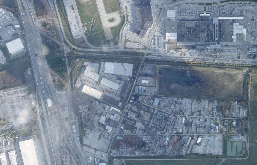 This satellite image from Planet Labs PBC shows the crash site of the UPS plane just south of Muhammad Ali International Airport in Louisville, Kentucky, on Monday.