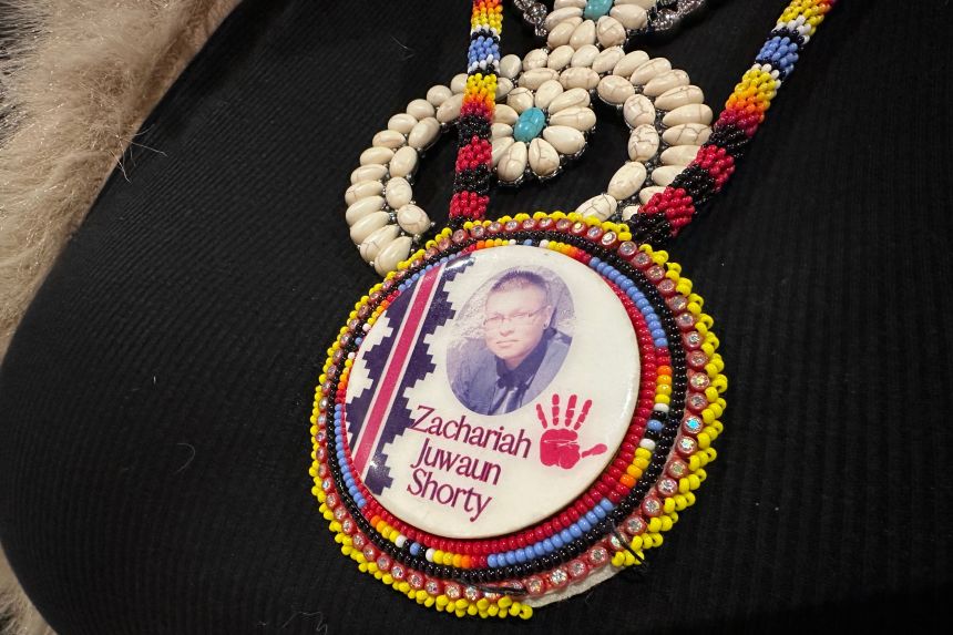 Vangie Randall-Shorty wears a button in memory of her son Zachariah Shorty in Bernalillo, New Mexico, on November 24, 2025.
