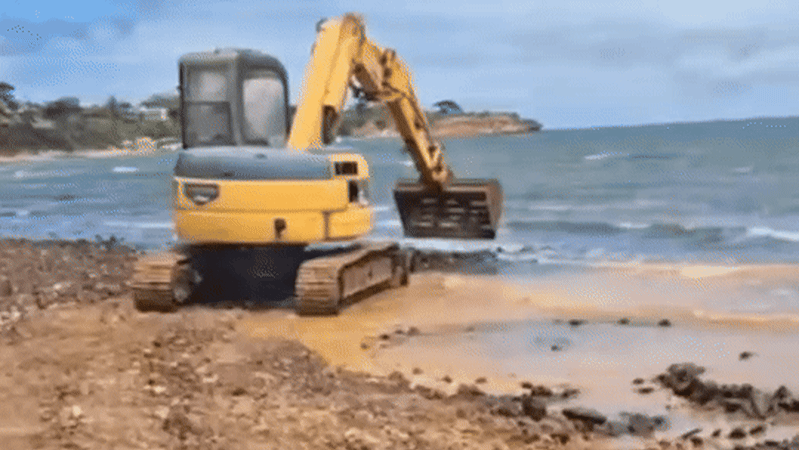 Unauthorised excavator damages beach near Olivers Hill