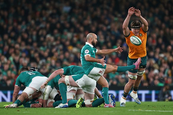 Ireland’s Jamison Gibson-Park, center, kicks the ball.