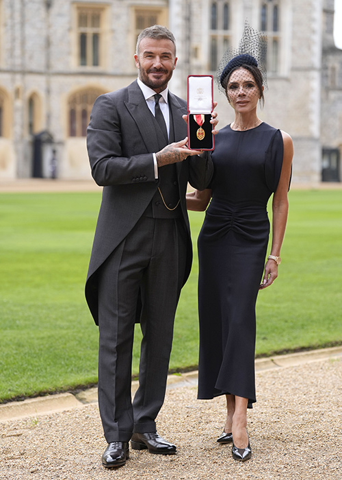 Sir David Beckham, with his wife Lady Victoria, after he was made a Knight Bachelor at an investiture ceremony at Windsor Castle, Berkshire