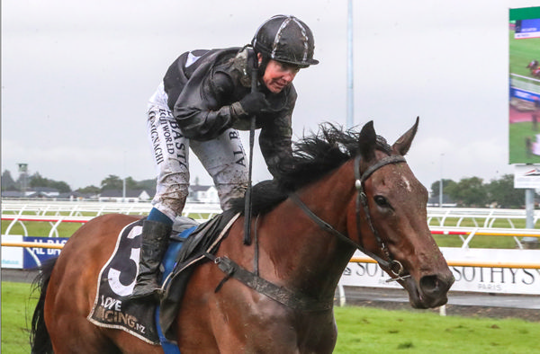 Jockey Tina Comignaghi celebrates a dominant victory by Bozo in the Gr.3 Martin Collins New Zealand Cup (3200m).   Photo: Race Images South